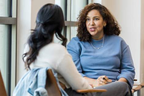 Photo of a counselor offering support to a client.
